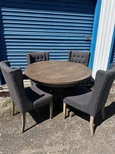 Round table and 4 upholstered chairs. This beautiful round table and chair set were in a lake condo...