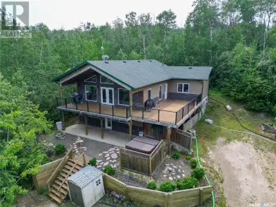 Welcome to your dream getaway! Nestled in nature, this spacious 5-bedroom home combines lake life wi...