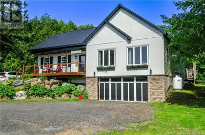 This beautifully designed home has mature, cedar hedges, apple and lilac trees, roses, lavender, and...