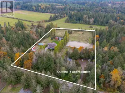Nestled on a serene and private 7.26-acre equestrian estate on Central Vancouver Island, this Victor...