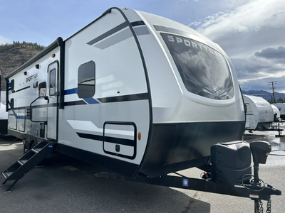 With double-over-double bunks, a private king bedroom, and a large slide-out, this trailer gives eve...