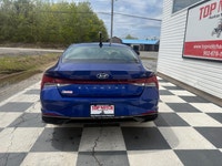 A stylish compact sedan with a modern interior, advanced technology, and efficient performance, offe... (image 4)