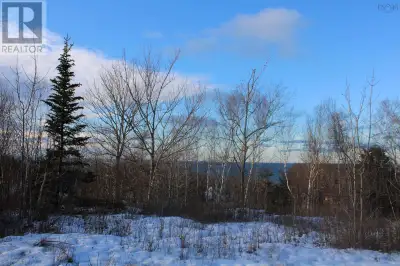 Soak in the delightful views and sounds of the Bay of Fundy from this spacious lot in the seaside co...