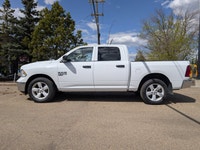 This pre-owned 2023 Ram 1500 Classic SLT Crew Cab is finished in Bright White with a clean Black and... (image 2)