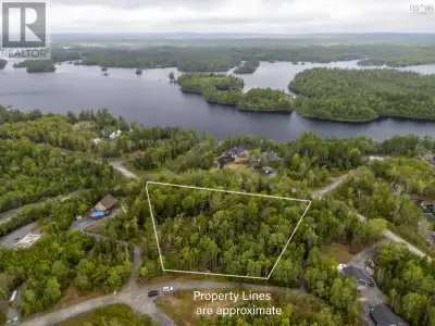 WATER VIEW POTENTIAL - Unit 25 Meek Arm Trail offers 1.55 acres of beautifully treed land, providing...