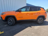 For a quick response please text 403-820-9940. AMVIC licensed business The 2026 Jeep Compass Trailha... (image 1)
