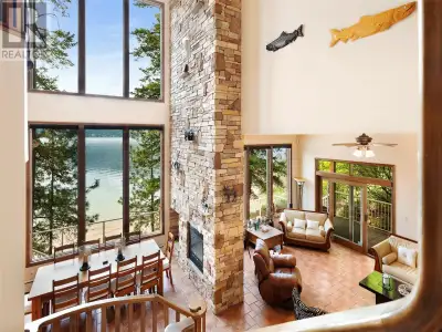 Custom Lakeshore Retreat on a Quiet Bay Nestled in a tranquil bay, this custom lakeshore home blends...