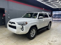 The 2015 Toyota 4Runner 4WD 4dr V6 SR5, in its striking White exterior paired with a robust 44 drive... (image 7)