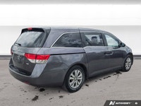 Experience the comfort and practicality of this pre-owned minivan, finished in elegant Alabaster Gre... (image 4)