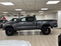 Among midsize pickups that talk tough but feel soft when the work gets real, this 2021 Toyota Tacoma... (image 2)