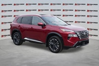 The 2025 Nissan Rogue Platinum, in striking Red, offers a sophisticated driving experience with only... (image 7)