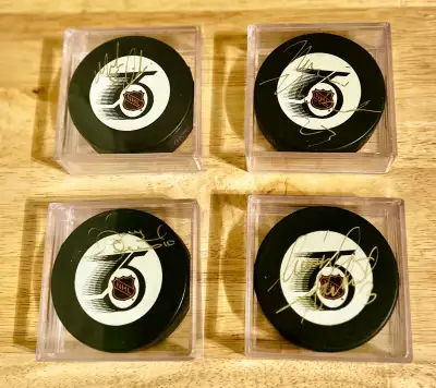 4 Signed Flames 1991-92 NHL 75th Anniversary Official Game Pucks, View more