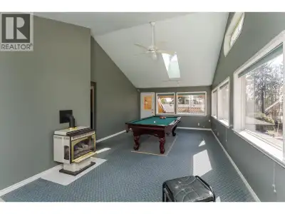 Unique centrally located home backing onto greenbelt with lane access, just minutes from hospital, s...