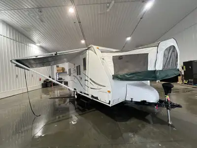 This hybrid floor plan has its pop out at the front and has a nice large panoramic udinette/sleeping...