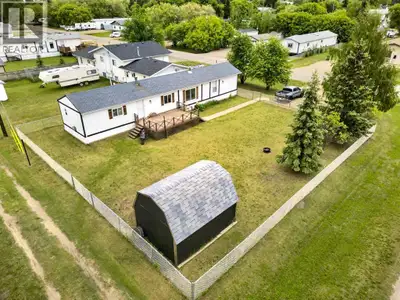 Welcome to this well-maintained 1,216 sq. ft. modular home situated on a 0.22-acre corner lot in tow...