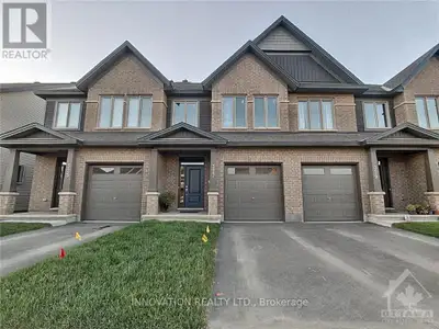 Welcome to this beautifully maintained Tartan Fuji model in the sought-after Findlay Creek community...