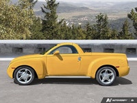 Commanding presence meets open-air freedom in this stunning Slingshot Yellow 2004 Chevrolet SSR LS,... (image 1)