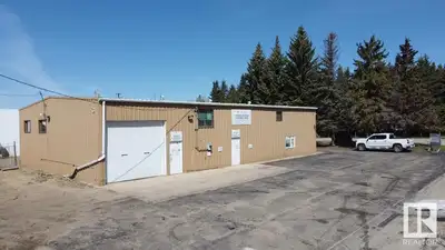 This well-maintained commercial property offers 4,000 sq. ft. of office space combined with an attac...