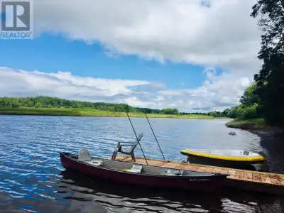 Welcome to 9662 Highway 311 in Waughs River, Nova Scotiaa riverfront chalet built in 2017 using Alan...