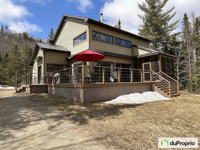 $775,000 - Cottage for sale in St-Côme — photo 1