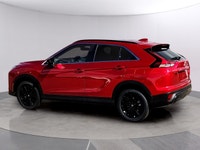 The 2026 Mitsubishi Eclipse Cross NOIR S-AWC, clad in a striking red exterior, combines the robust h... (image 4)
