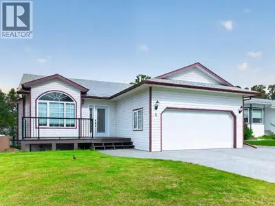 Executive living with built-in income potential! This beautifully upgraded bungalow offers an except...