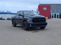 The pre-owned 2021 Ram 1500 Classic Express Crew Cab in Patriot Blue Pearl with a Black and Diesel G... (image 8)