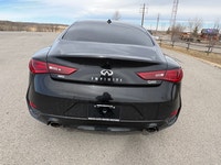 The 2017 Infiniti Q60 Premium is a luxurious 2-door coupe, often featuring a 300-horsepower 3.0L twi... (image 6)