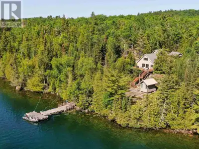 MLS® #TB241913 Nestled on 2.83 acres of serene wilderness, this water-access-only cabin boasts an im...