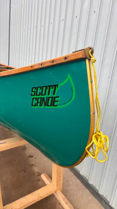 A 16 ft used Scott Wilderness Beautiful fiberglass canoe with wood gunnels and wicker seats. Approxi...
