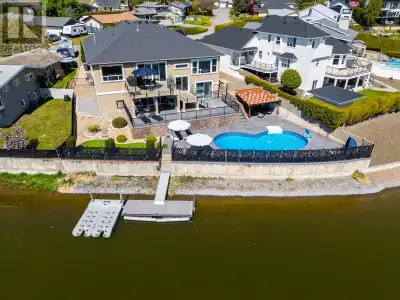 Experience luxury waterfront living on the Pritchard Canal in this exceptional custom-built home wit...