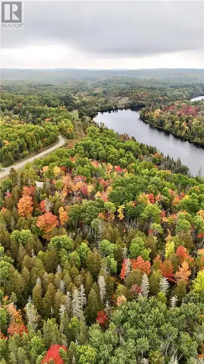 This waterfront 8 acre lot on the Spanish River offers over 2000 feet of water frontage and a little...