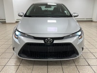 Dawn paints the streets in quiet silver as the 2021 Toyota Corolla L slips from the curb, its LED be... (image 7)