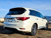 The 2017 INFINITI QX60 AWD in elegant white is a true performer with its reliable all-wheel drive an... (image 4)