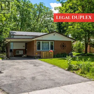Turnkey Duplex Investment in a Prime Waterloo Location! Situated on an expansive 62' x 147' mature l...