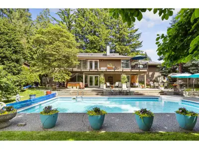 Extraordinary mid-century modern rancher, with seamless indoor-outdoor living and entertaining. Nest...
