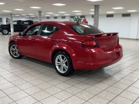 A red 2011 Dodge Avenger SXT easing through the day has a way of making routine driving feel more de... (image 3)