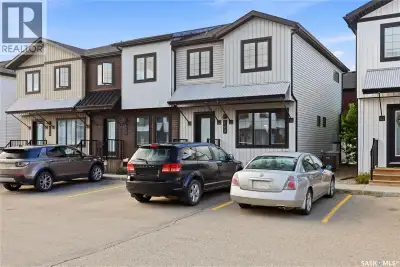 This beautifully maintained, effortless living end unit 4-bed, 3-bath townhouse built 2018 is snuggl...