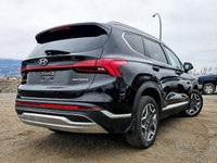 The 2022 Hyundai Santa Fe Hybrid Preferred in sleek Black with an AWD drivetrain offers balanced han... (image 1)