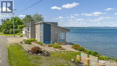 WATERFRONT property, this contemporary home has been redesigned, remodeled and updated, both inside...