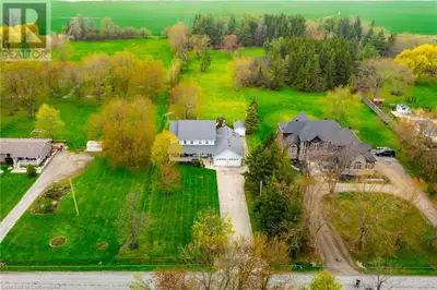 Welcome to this picturesque country retreat, nestled on a tranquil 1-acre lot surrounded by mature t...