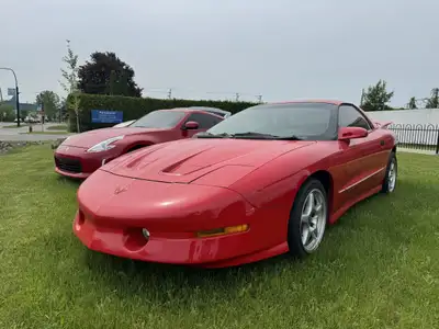 La Pontiac Firebird Trans Am 1994 est lun des modèles les plus emblématiques de lère des voitures sp...