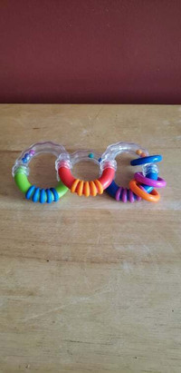 Toy, keeps little fingers busy, bends, little balls rattle, ring