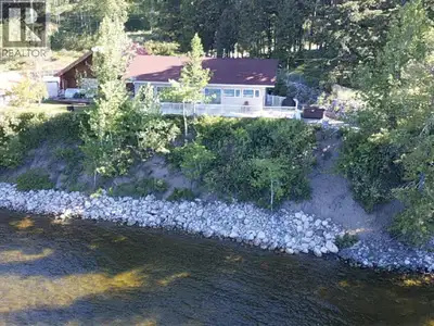 Experience year-round lakeside living at its finest in the only full-time residence within the exclu...