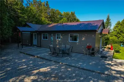 Welcome to 75 Holmes Street in Spring Bay on Manitoulin Island! This charming west-facing bungalow s...