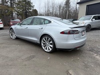 Experience the exceptional performance of the 2015 Tesla Model S P85D, a stunning silver AWD sedan r... (image 2)