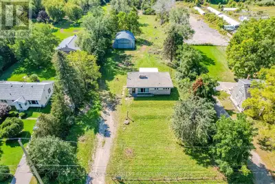 Enjoy this 2 acre county bungalow as is or or convert into a stunning custom home in a prime Waterdo...