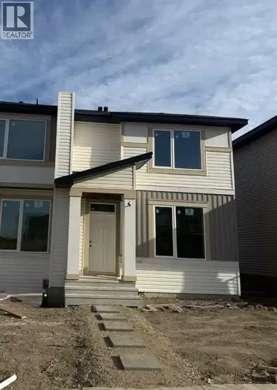 This new construction triplex Home in the Town of Crossfield AB that is under construction and sched...
