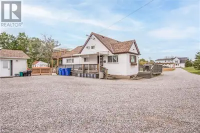 Beautiful 1 1/2 storey home with additional residence and bunk houses on a 1.92 acre lot backing on...