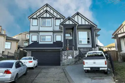 Discover this grand 3-level residence in desirable East Newton. This expansive home offers over 5,60...